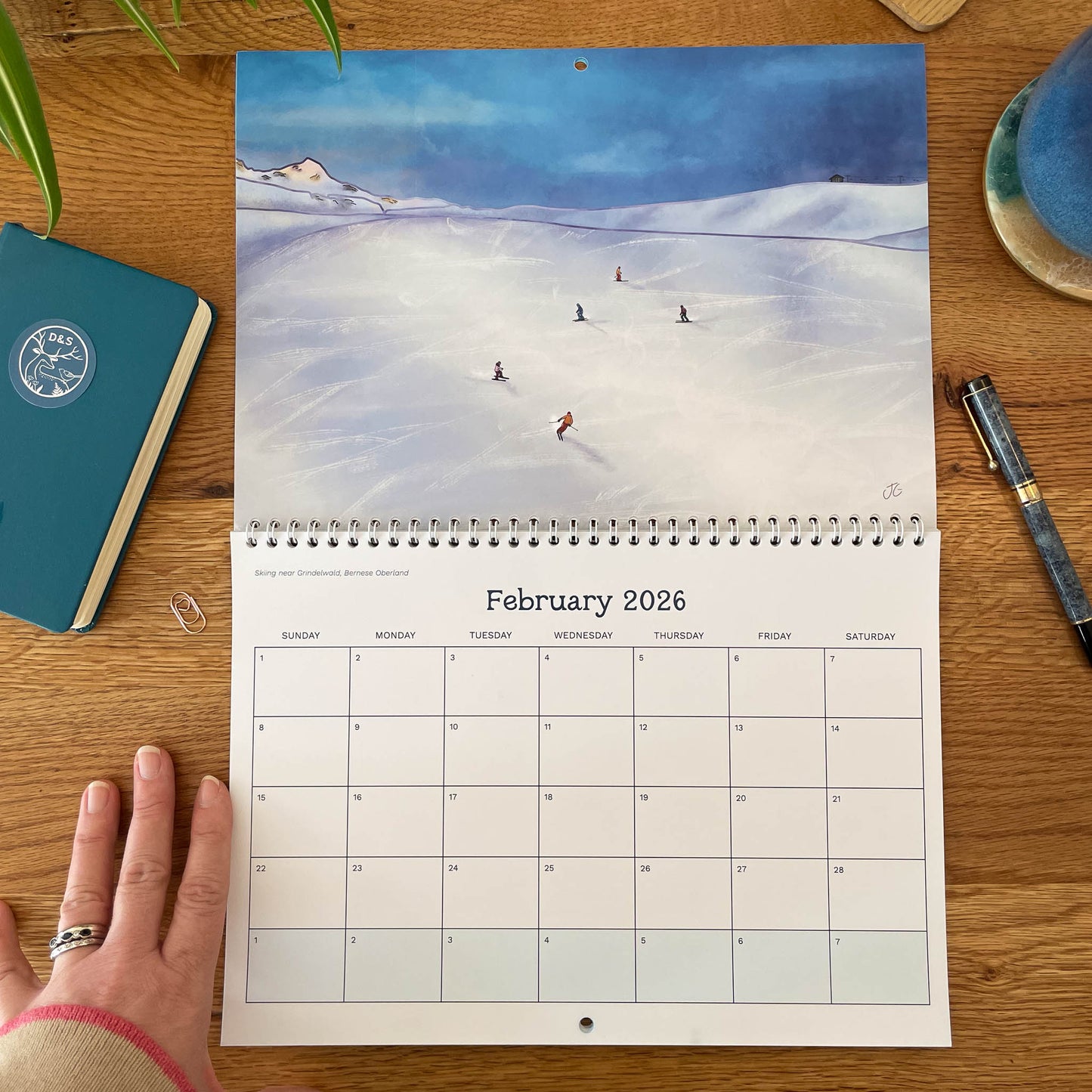 February spread Ski scene near Grindelwald with A4 image and A4 monthly layout.