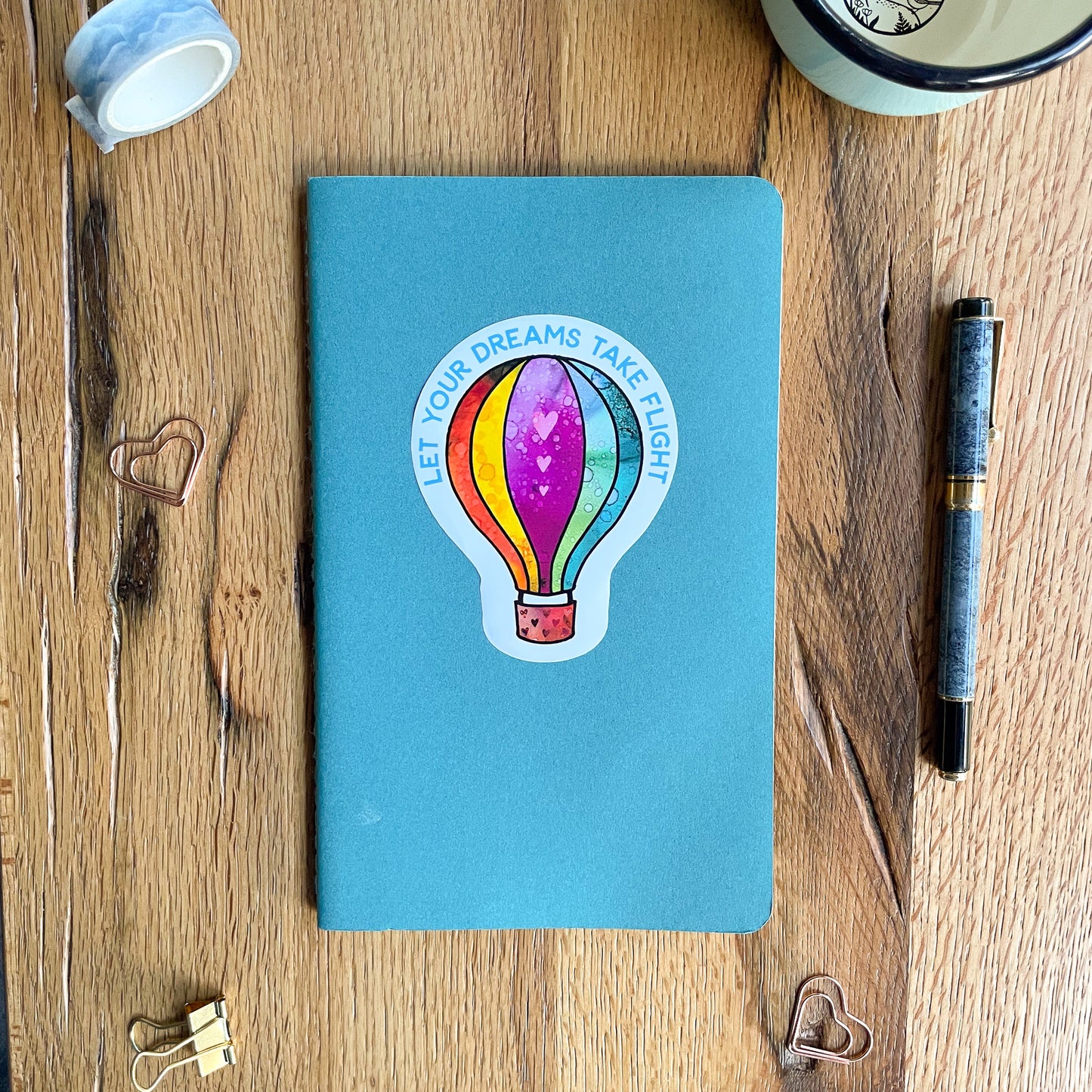 Bring the joy and wonder of hot air ballooning into your world through our high-quality vinyl sticker, reminding you to always reach for the sky.