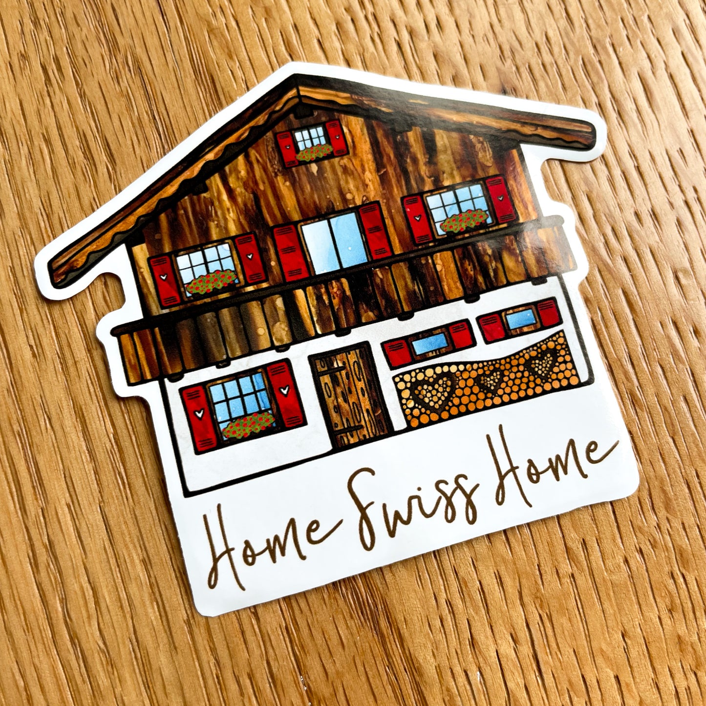 Bring home the memories of Switzerland with this vibrant vinyl sticker featuring an iconic Swiss Chalet design - a true collector's item.