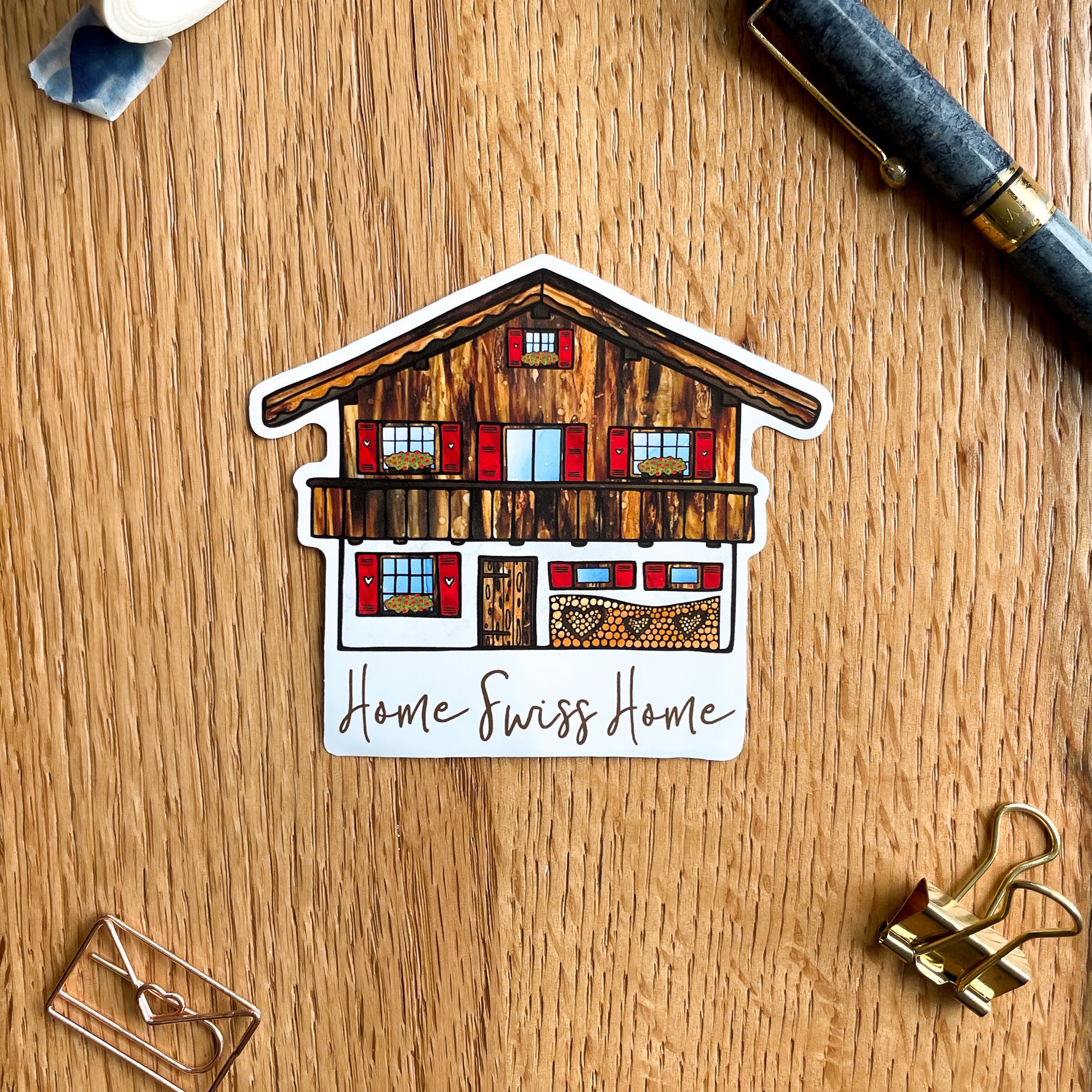 Capture the essence of an idyllic Swiss house with this beautiful vinyl sticker, a must-have souvenir for any lover of Switzerland.