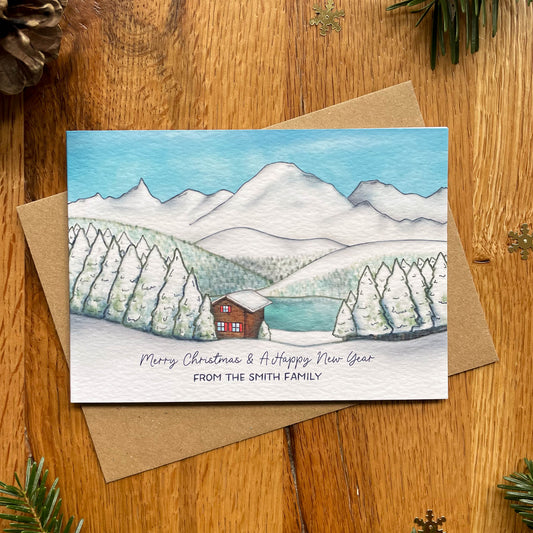 Set of Personalised Family Christmas Card with Snowy Mountain Scene, Alpine Lake & Mountain Cabin