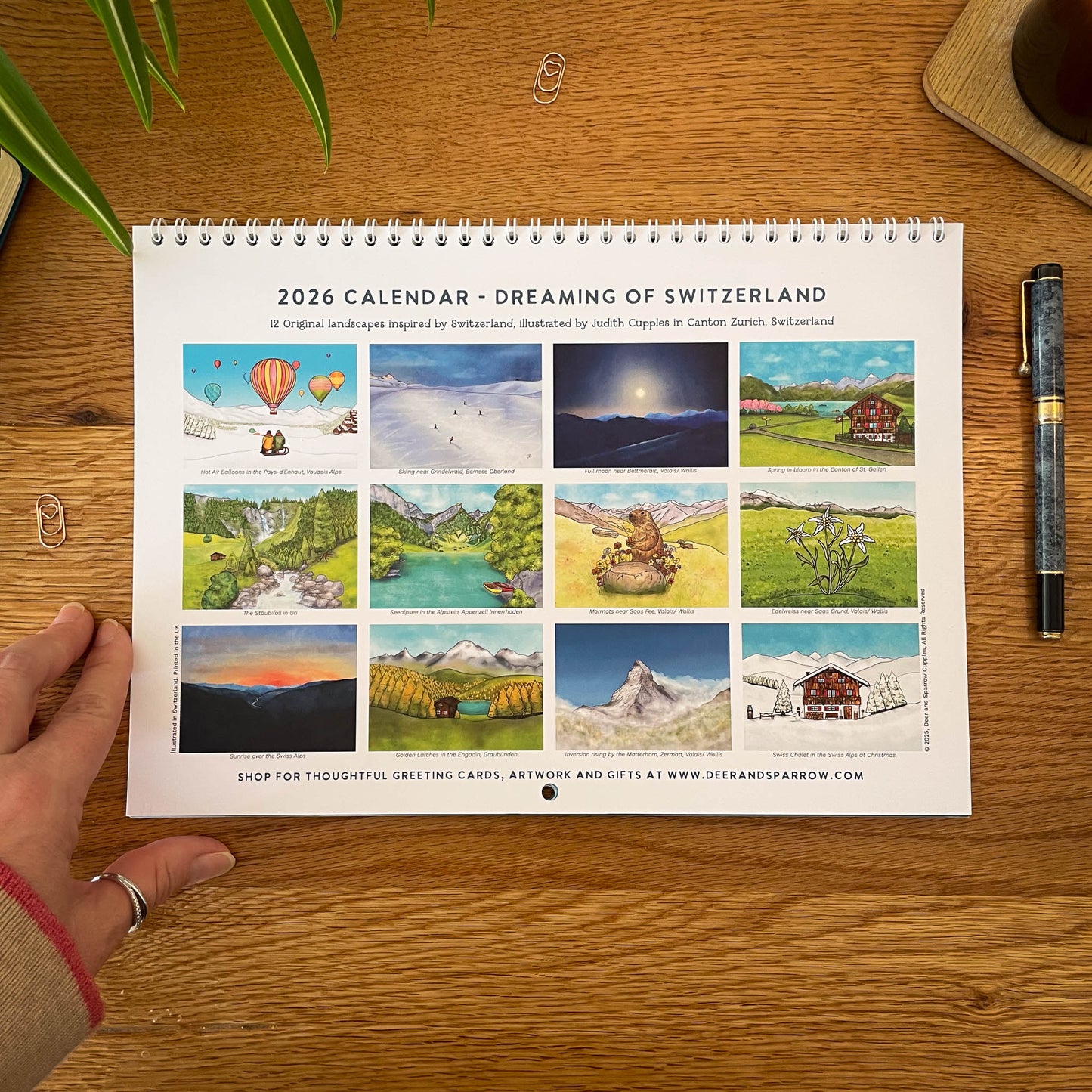 Back Cover of  2026 Switzerland themed calendar with 12 cohesive Alpine illustrations, spiral bound.