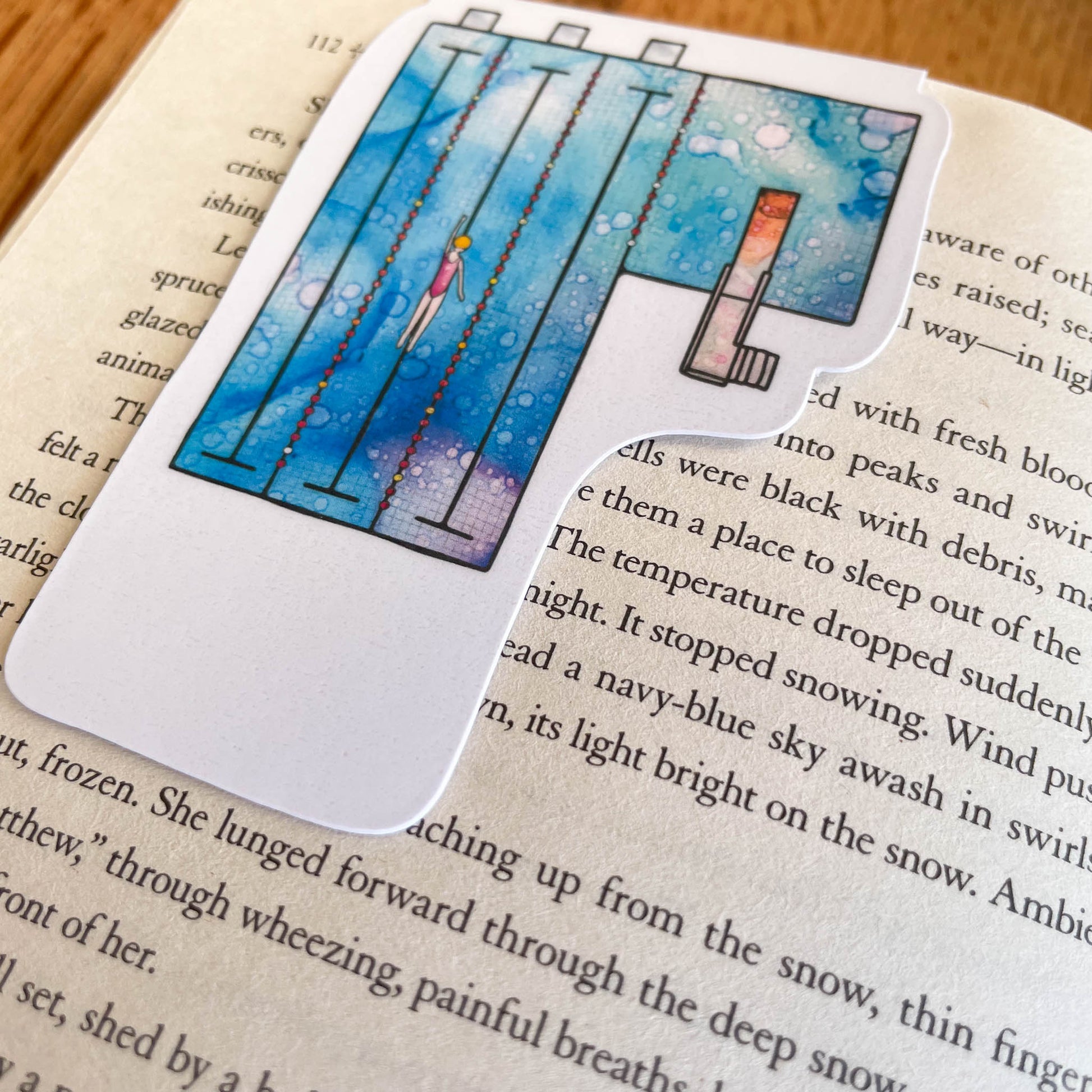 Laminated swimming pool magnetic bookmark for marking pages in books
