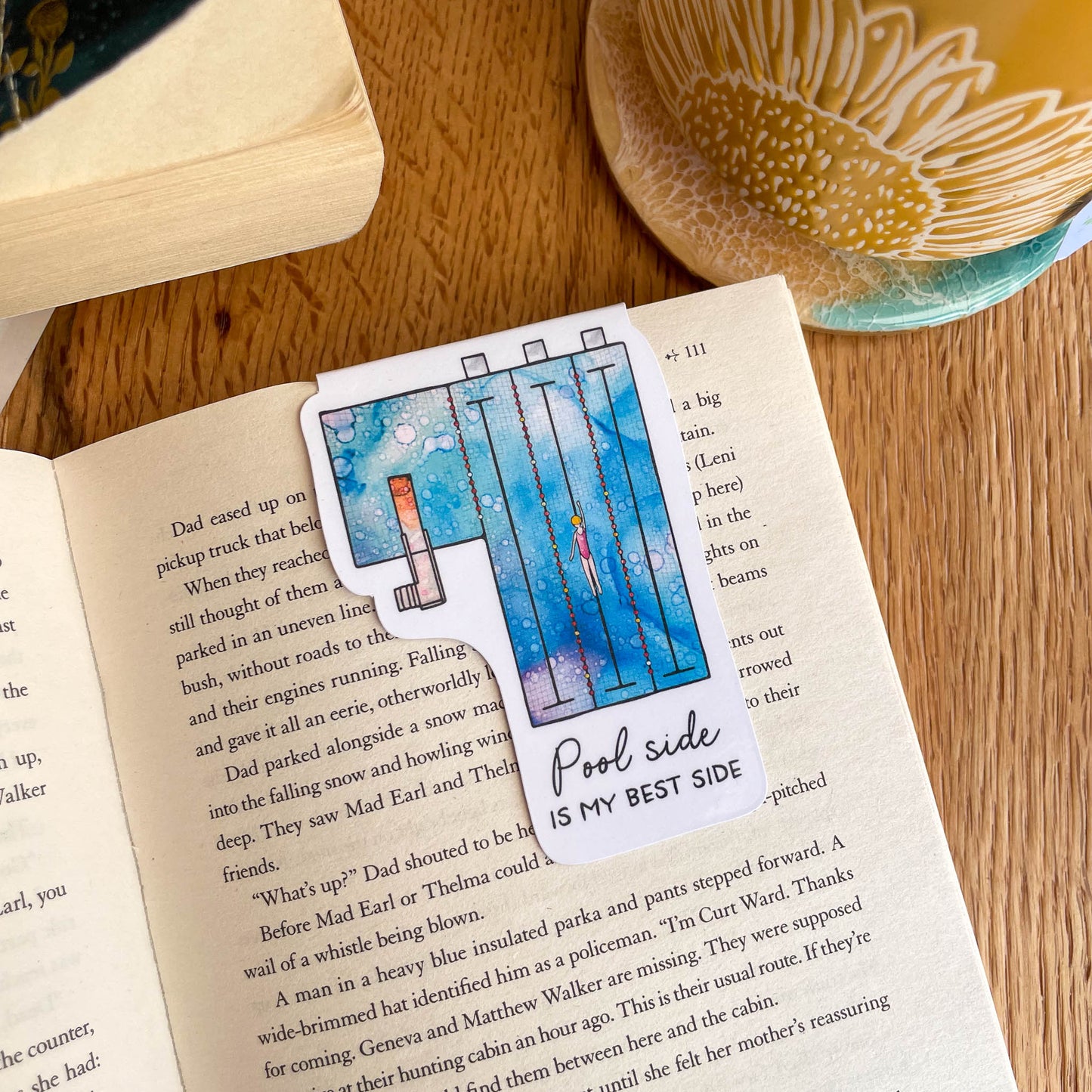 Illustrated magnetic bookmark of a swimming pool scene - a must-have for avid readers