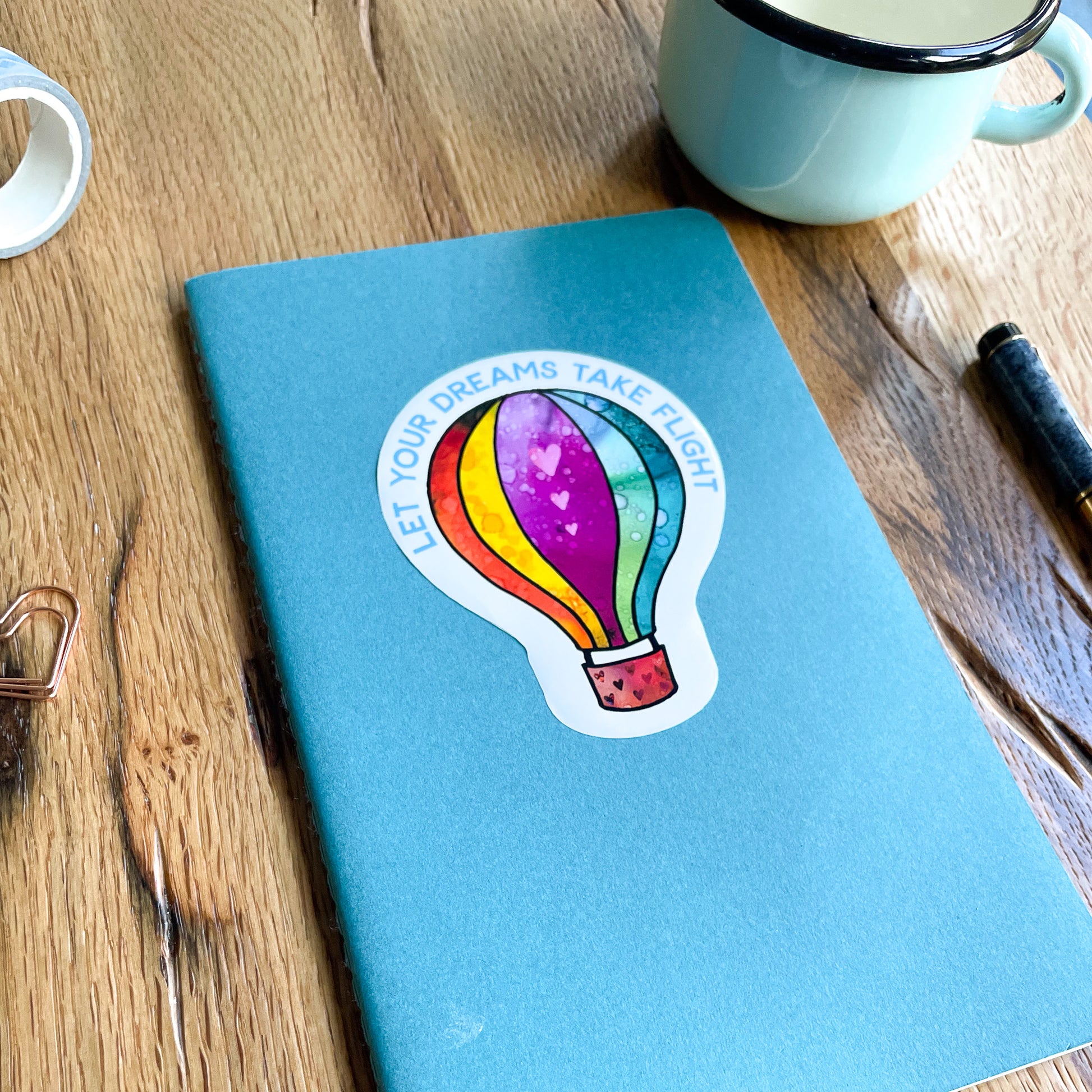 Let the beauty and symbolism of a hot air balloon soar in your surroundings with our eye-catching vinyl sticker